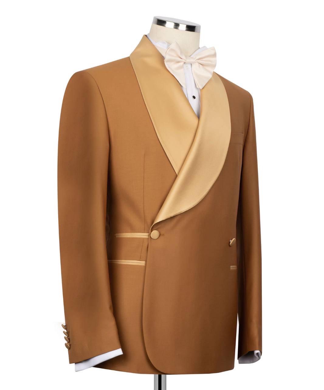 Brown tuxedo jacket with gold lapels on a mannequin against a white background