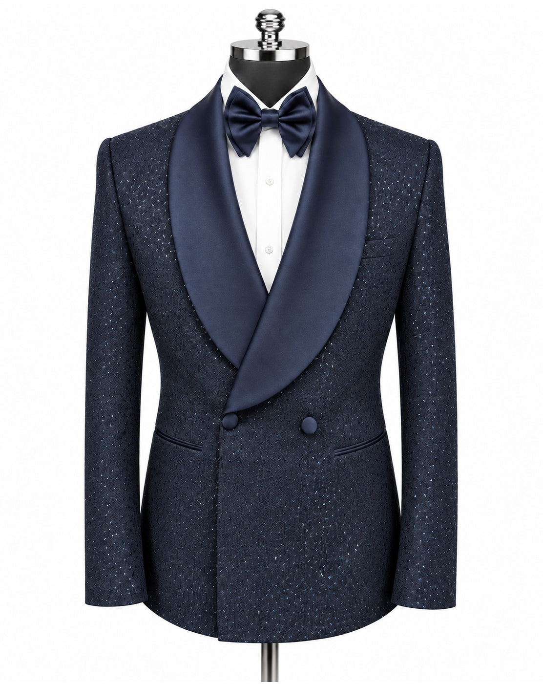 A men's double-breasted tuxedo jacket in navy blue textured tweed with a contrasting solid navy satin shawl collar, styled on a mannequin with a white dress shirt and matching navy bow tie against a plain white background.