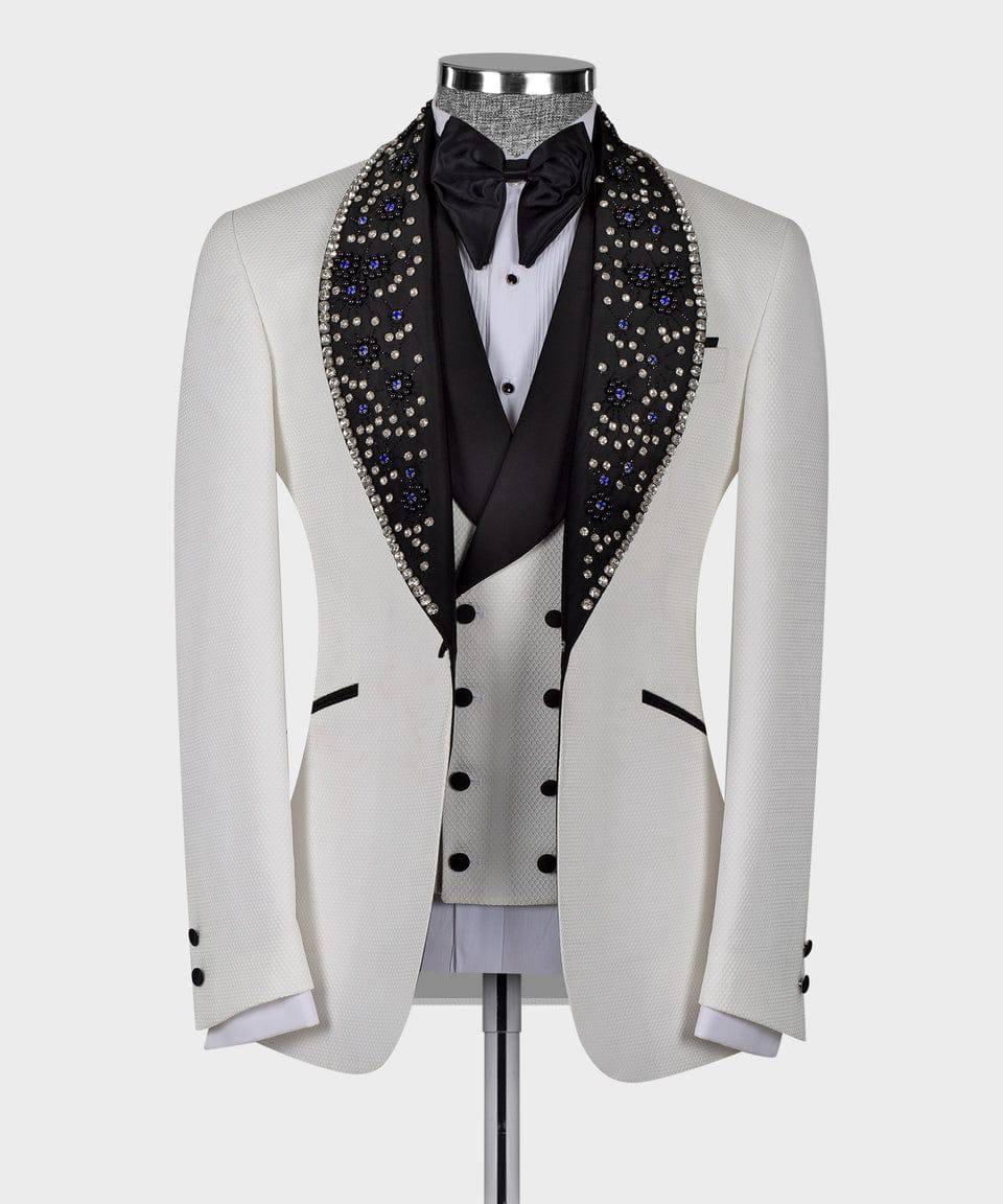 White tuxedo jacket with black lapels and studded details on a mannequin against a white background