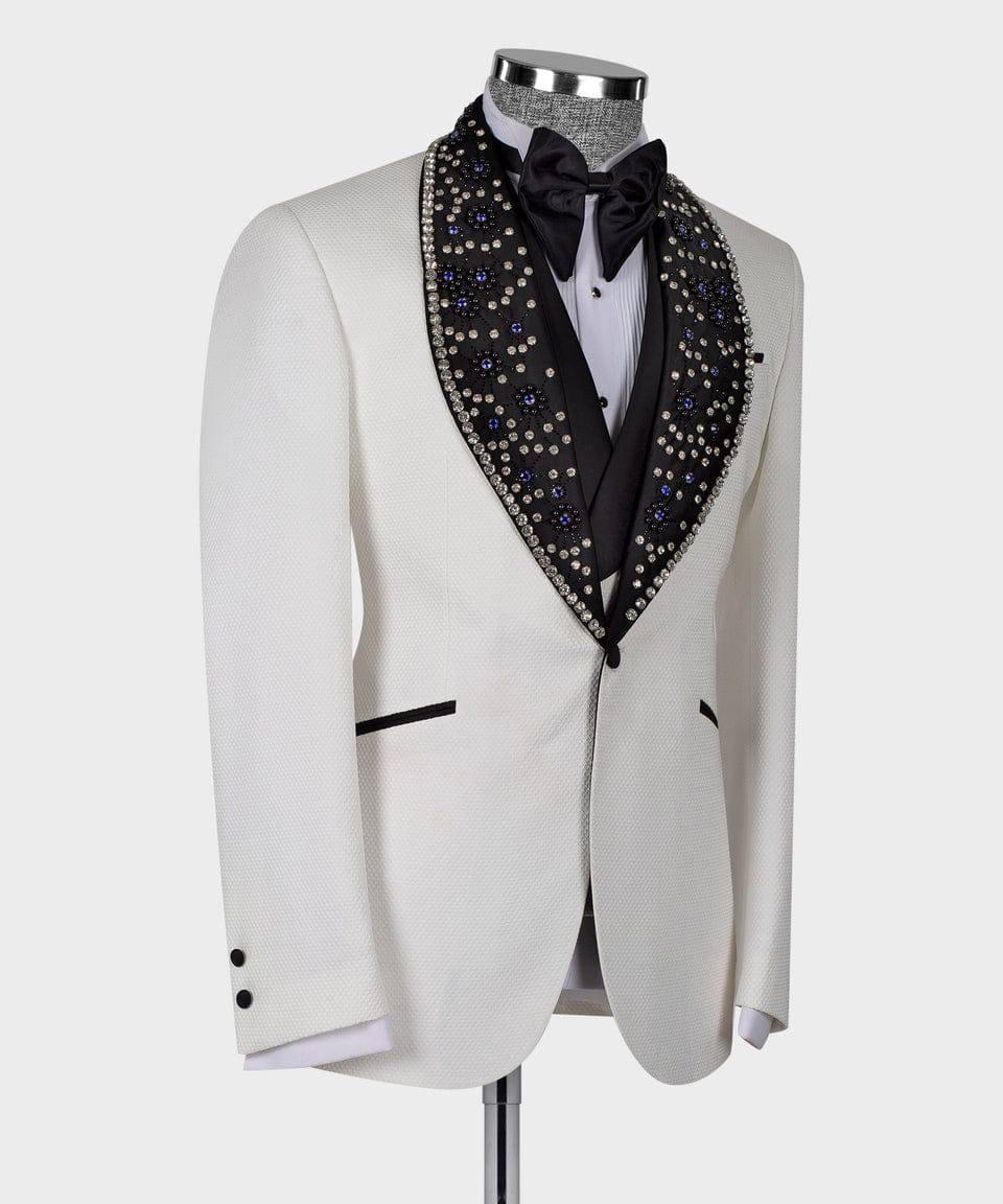 White tuxedo with black lapels and a decorative vest on a mannequin against a white background