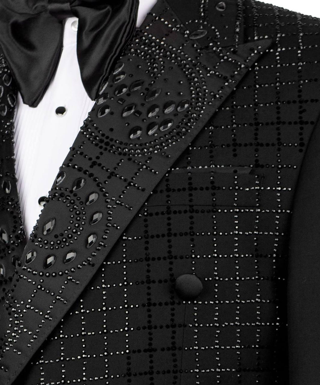 Black tuxedo with intricate detailing on a suit jacket and vest.