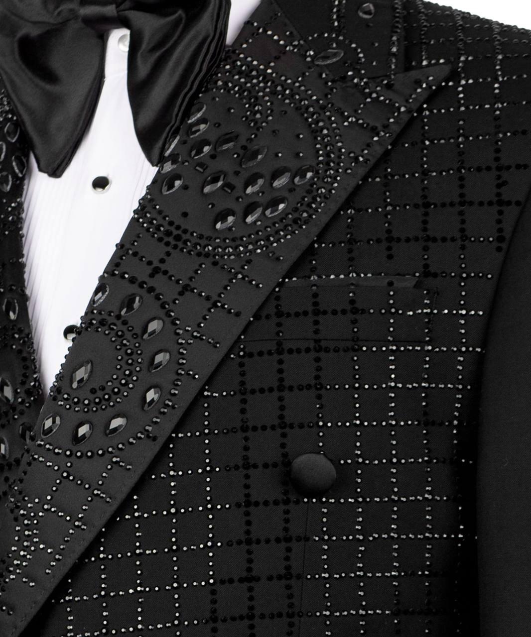 Black tuxedo with intricate detailing on a suit jacket and vest.