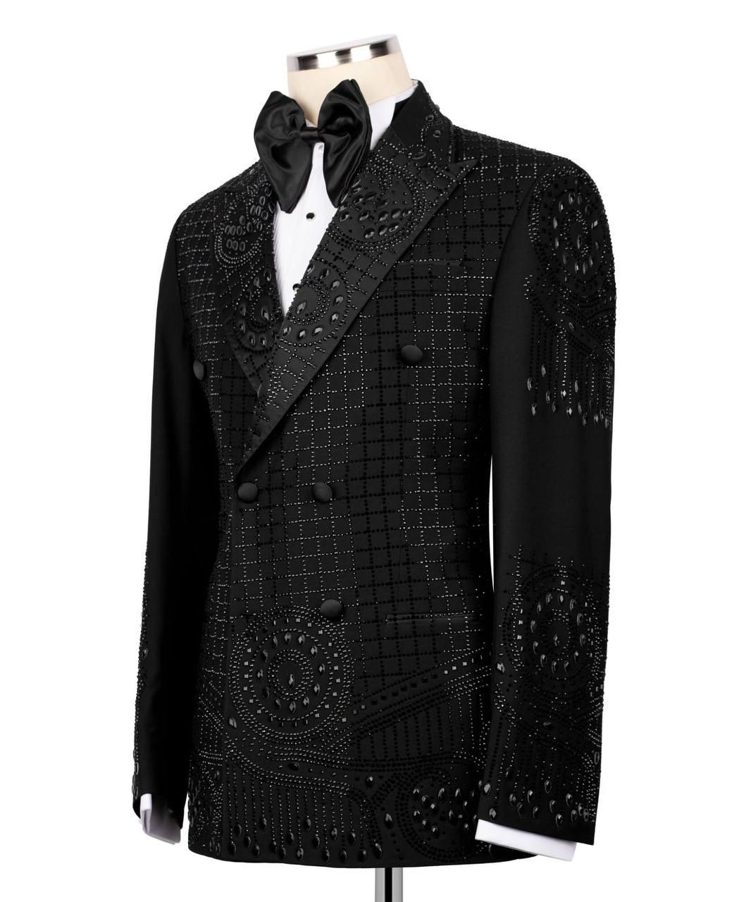 Black tuxedo with intricate detailing on a white background
