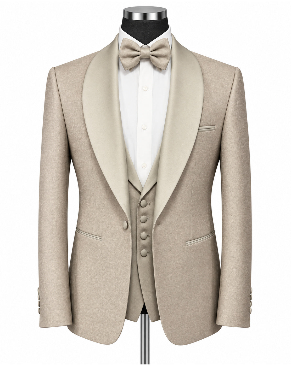 A men's formal tuxedo jacket with satin peak lapels in a light beige/champagne color, styled on a mannequin with a white dress shirt, matching beige bow tie, and a matching beige vest.