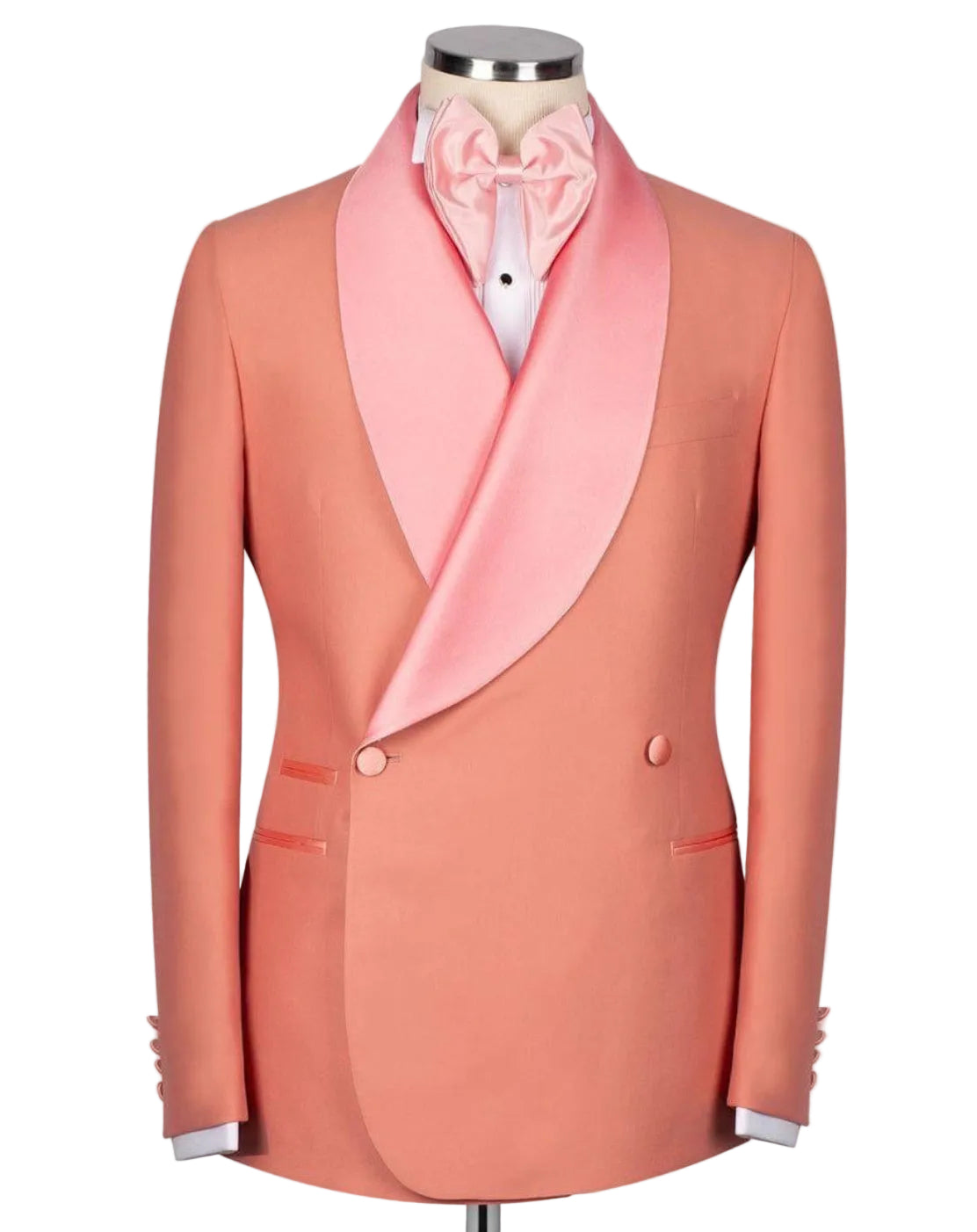 A peach-colored double-breasted tuxedo jacket with a contrasting light pink satin shawl collar, styled on a mannequin with a matching pink satin bow tie and white dress shirt.