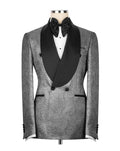 A men's double-breasted tuxedo jacket with a textured silver-gray patterned fabric body and contrasting black satin shawl collar, displayed on a mannequin with a black bow tie and white shirt.