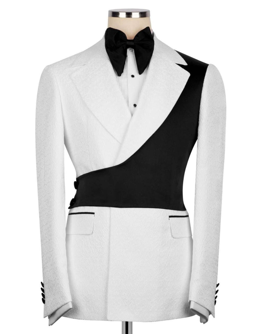 White and black tuxedo jacket on a mannequin with a bow tie against a white background