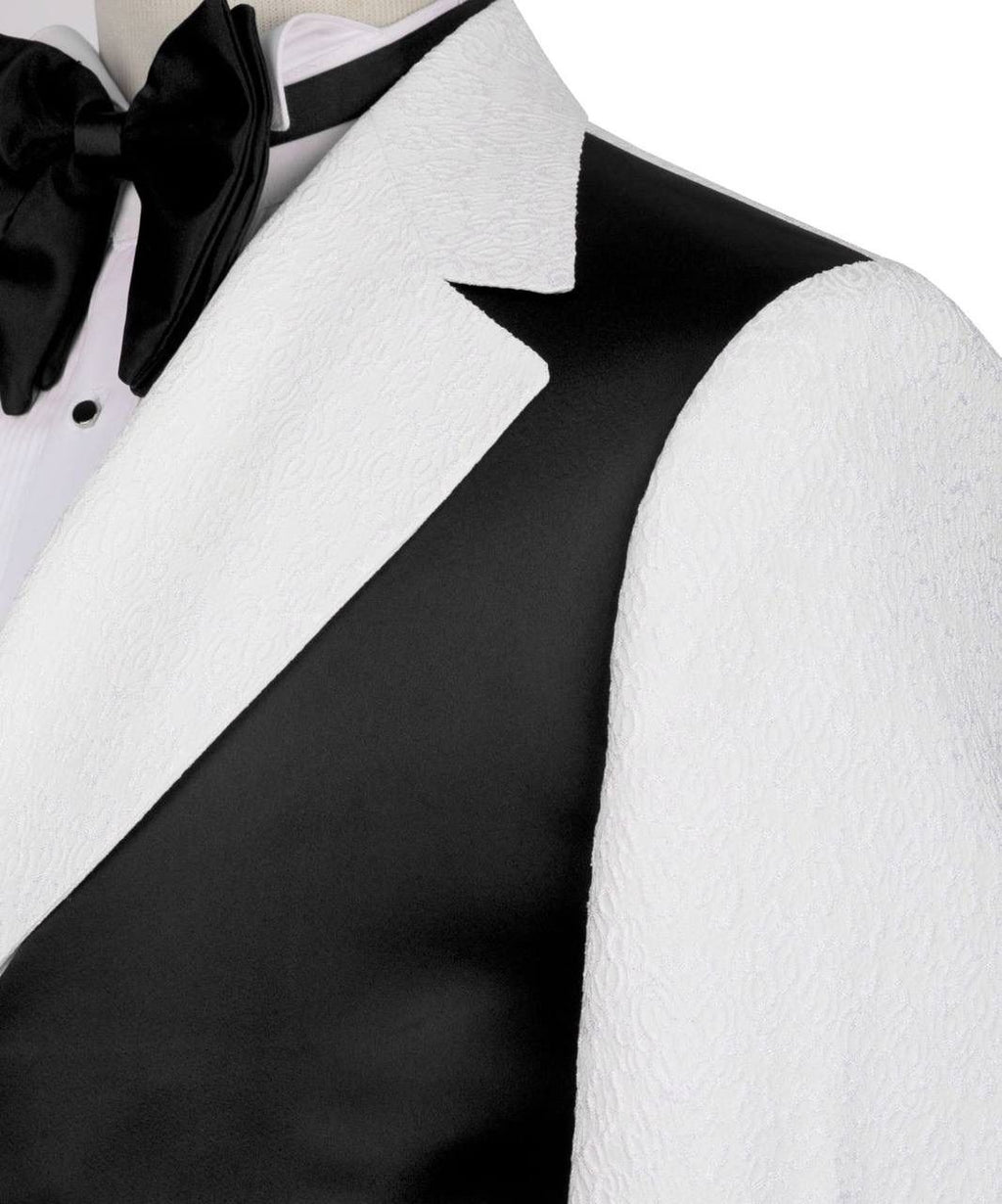 Close-up of a black and white tuxedo with a bow tie on a white background