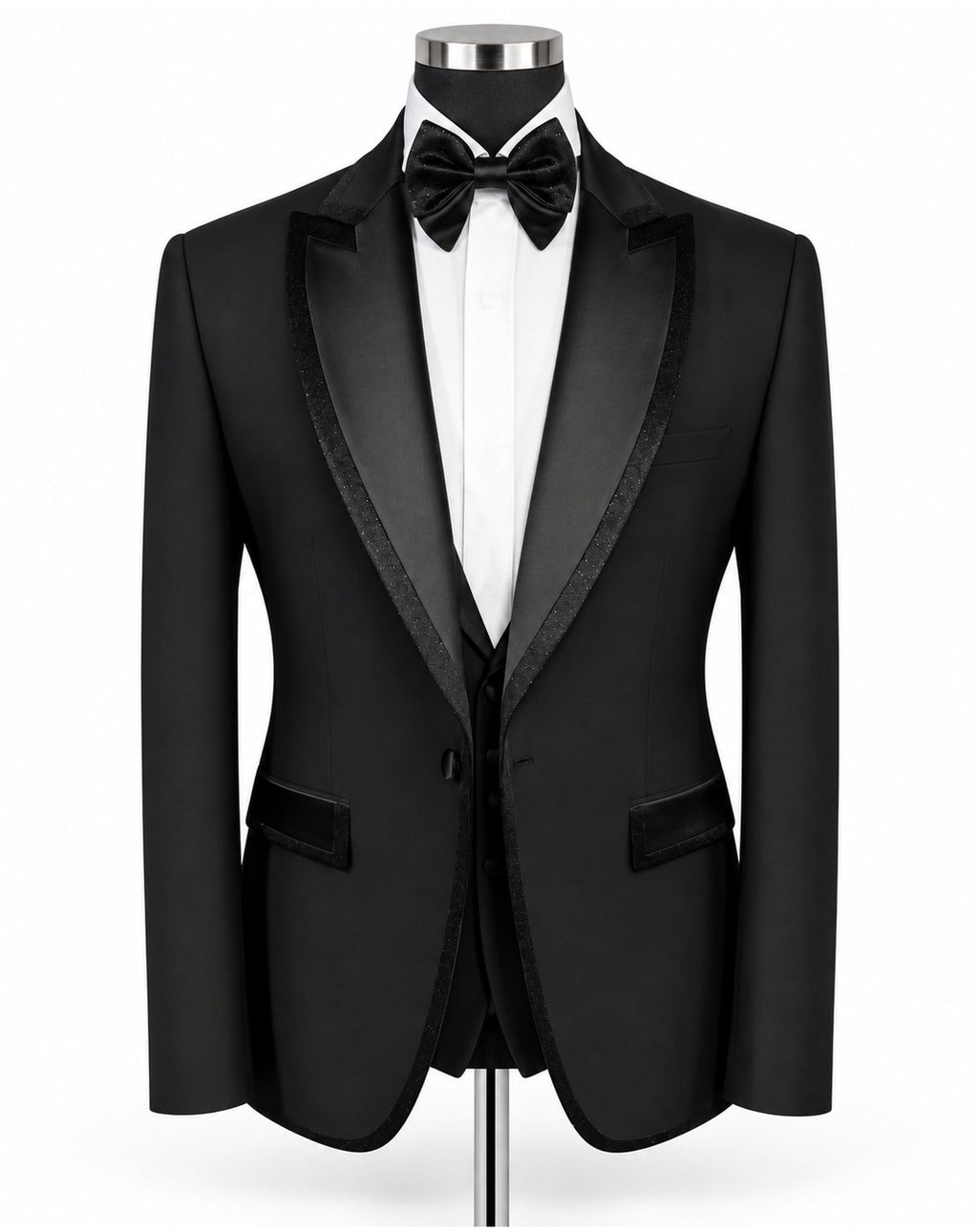 A black tuxedo jacket with satin lapels, displayed on a mannequin torso with a white dress shirt, black bow tie, and matching vest against a plain white background.