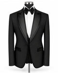 A black tuxedo jacket with satin lapels, displayed on a mannequin torso with a white dress shirt, black bow tie, and matching vest against a plain white background.