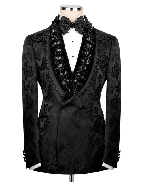 Black embroidered tuxedo jacket on a mannequin against a white background
