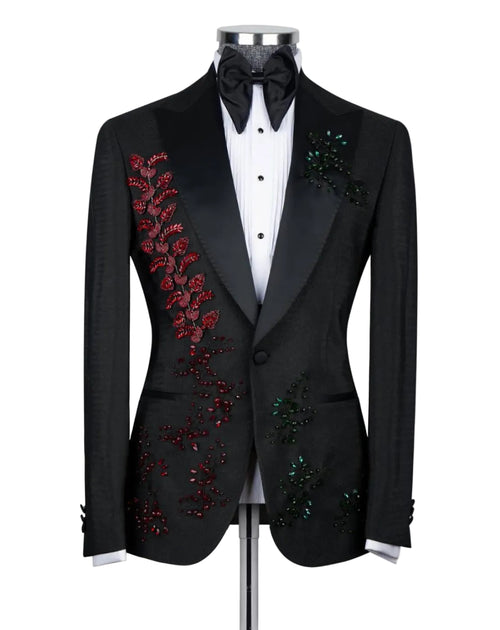 Black embroidered tuxedo jacket on a mannequin with a white shirt and black bow tie.