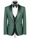 A men's formal tuxedo jacket in emerald green with satin black shawl lapels, displayed on a mannequin with a white dress shirt, matching green bow tie, and green vest against a plain white background.