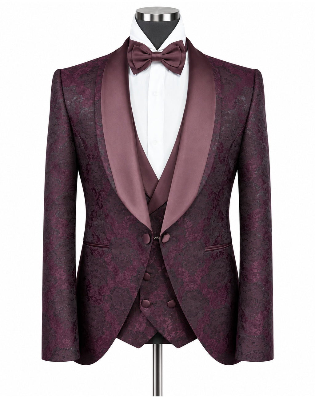A men's formal tuxedo jacket with matching waistcoat vest, displayed on a mannequin with a white dress shirt and matching burgundy bow tie. The jacket features a subtle damask pattern in deep burgundy and purple, with satin shawl lapels.