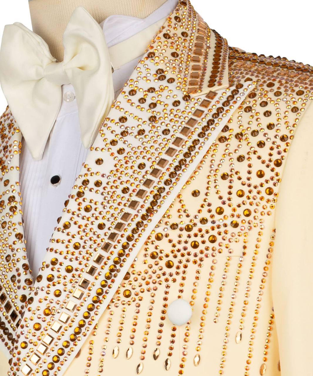 Close-up of a vest with gold embellishments and a white bow tie.