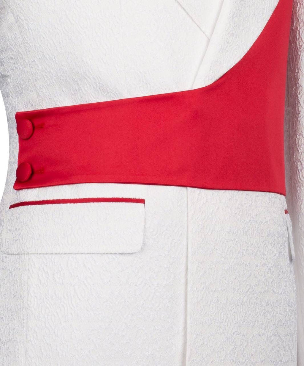 Close-up of a white garment with a red accent and button