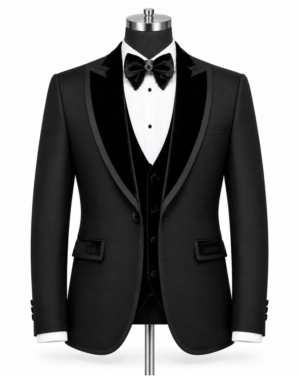A black tuxedo jacket displayed on a mannequin torso with a black velvet vest, white dress shirt, black bow tie, and black bowler hat against a plain white background.