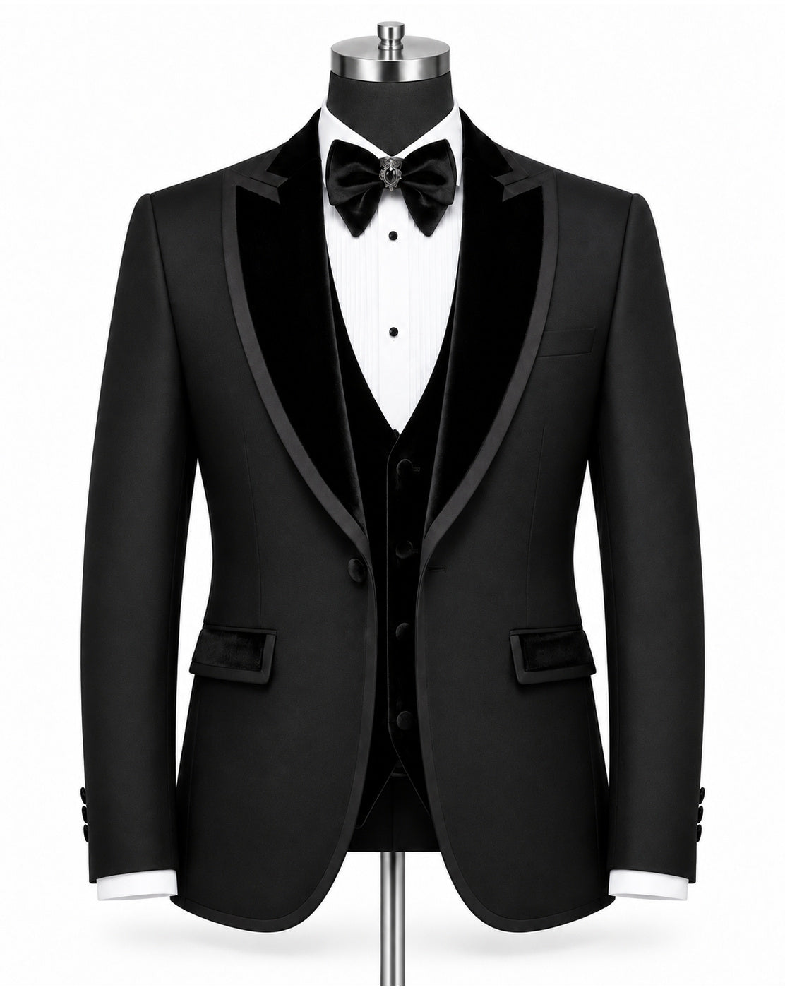A black tuxedo jacket displayed on a mannequin torso with a black velvet vest, white dress shirt, black bow tie, and black bowler hat against a plain white background.