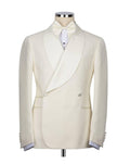 An ivory double-breasted tuxedo jacket with a shawl collar, displayed on a mannequin with a matching bow tie and white dress shirt against a plain white background.