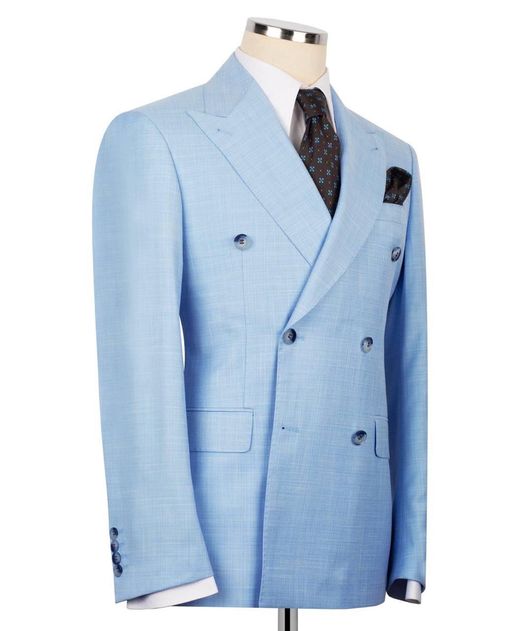 A light blue double-breasted suit jacket displayed on a mannequin torso, styled with a white dress shirt, a dark patterned tie, and a matching pocket square against a plain white background.