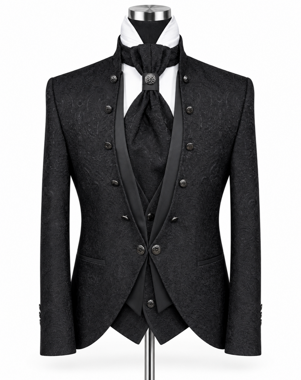 A black double-breasted formal suit displayed on a mannequin, featuring a textured jacquard pattern, satin peak lapels, a matching vest, tie, and cravat, with a white shirt underneath.