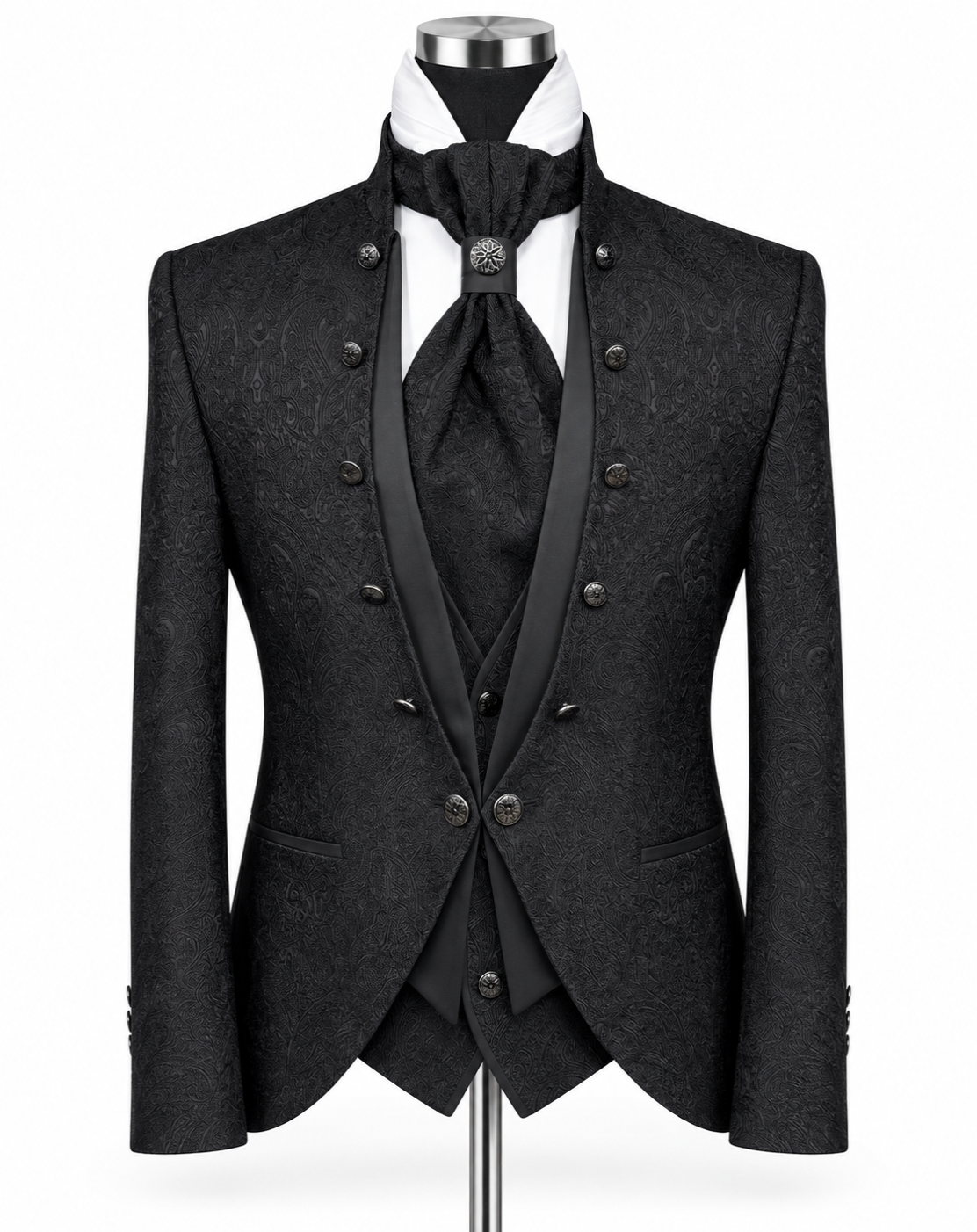 A black double-breasted formal suit displayed on a mannequin, featuring a textured jacquard pattern, satin peak lapels, a matching vest, tie, and cravat, with a white shirt underneath.