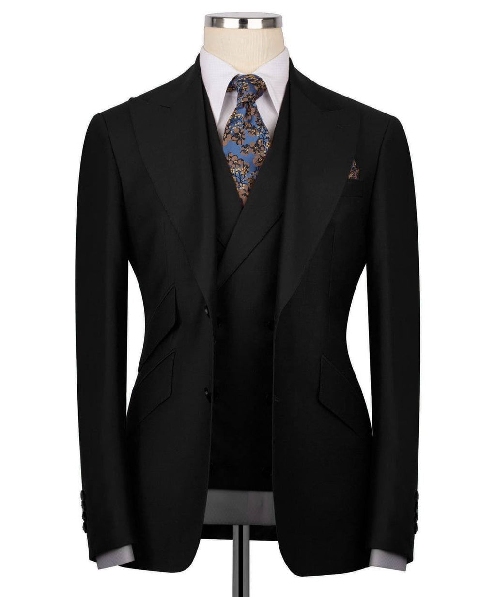 Black suit jacket with a patterned tie on a mannequin against a white background