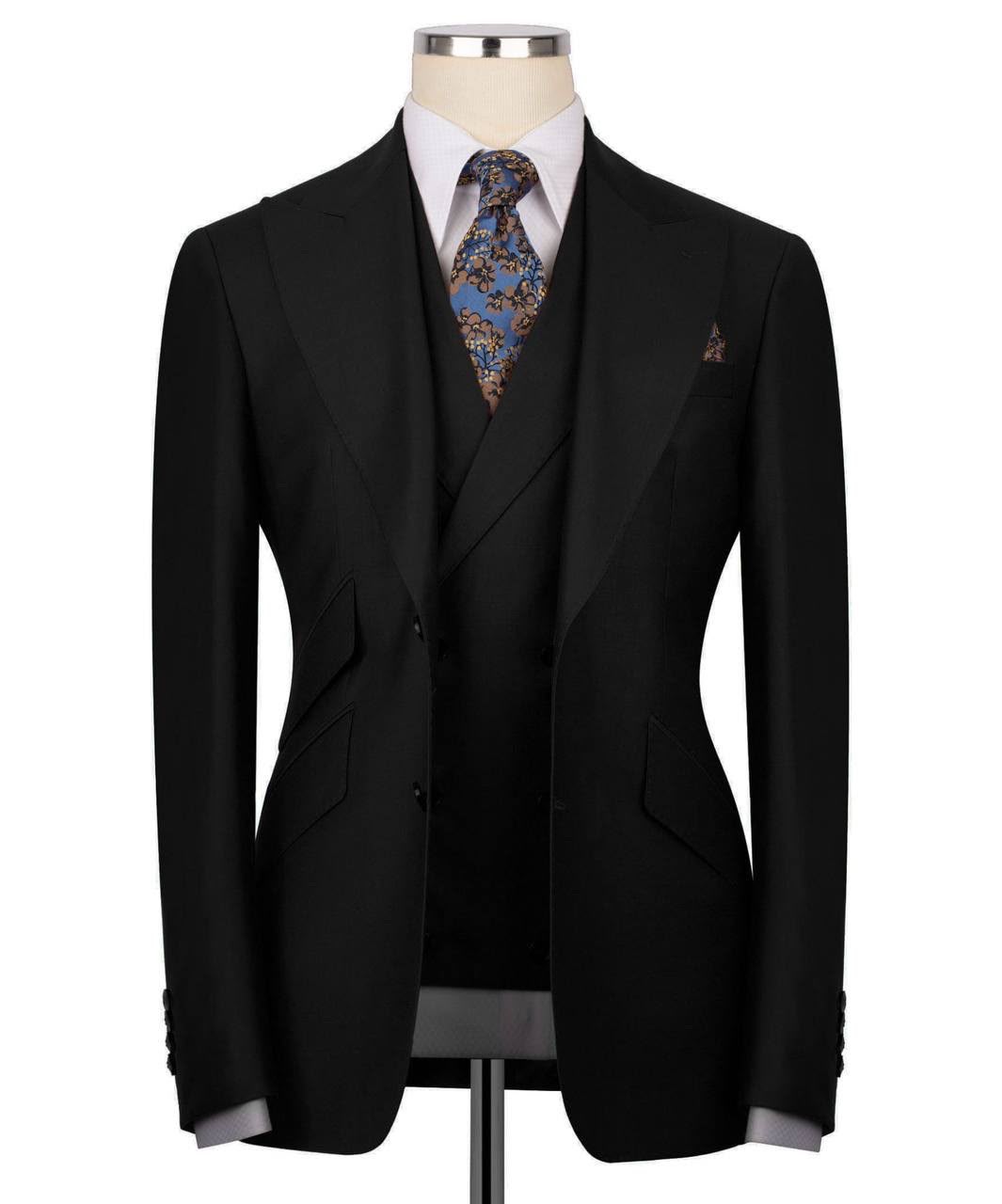 Black suit jacket with a patterned tie on a mannequin against a white background