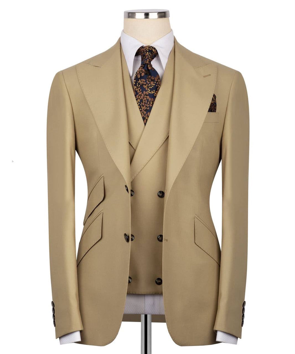 A beige double-breasted suit jacket with matching vest, styled on a mannequin with a white dress shirt and a patterned tie.