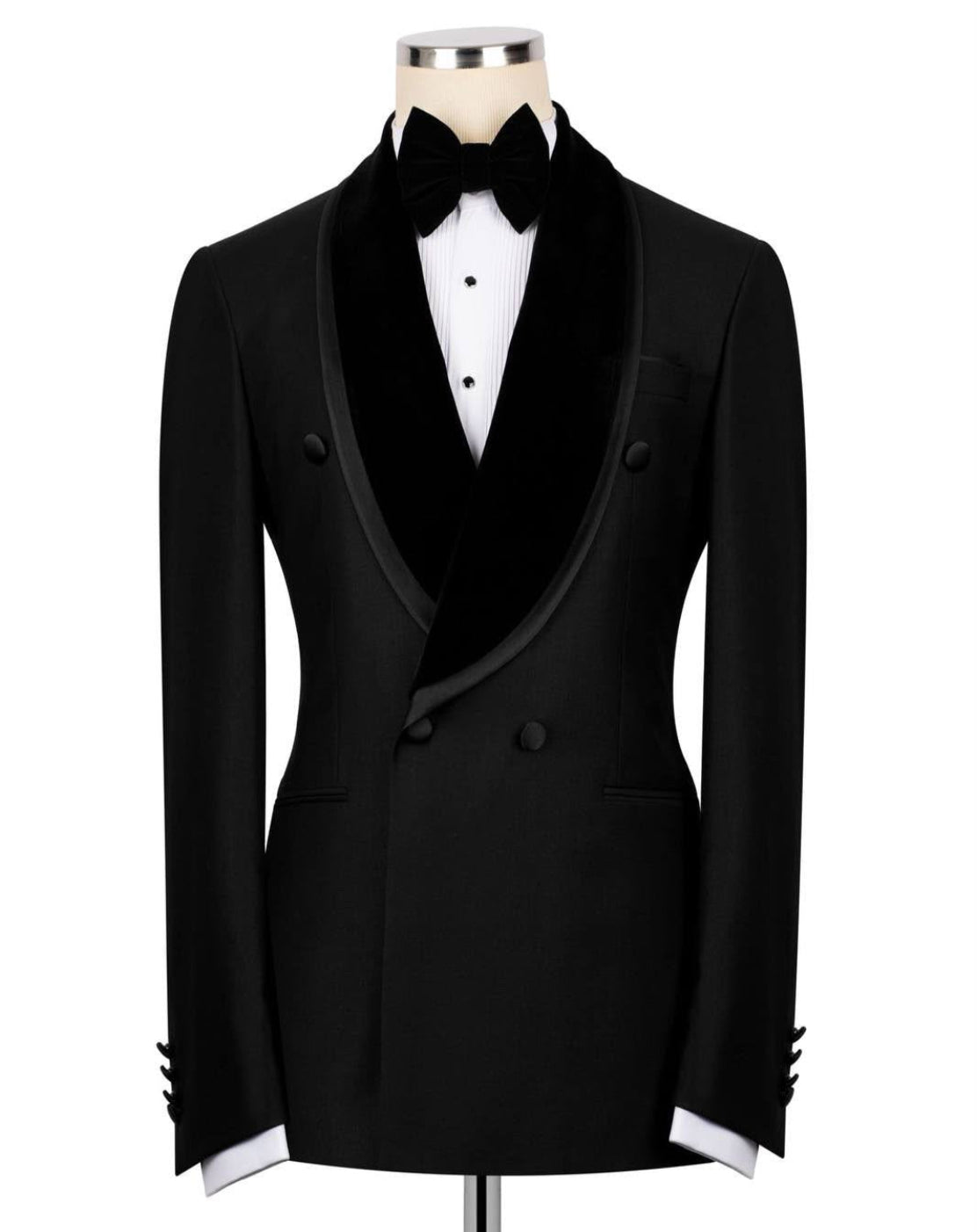 Black tuxedo jacket with white shirt and bow tie on a mannequin 