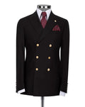 A black double-breasted suit jacket displayed on a mannequin, featuring gold buttons, a white dress shirt, a burgundy patterned tie, and a matching pocket square 