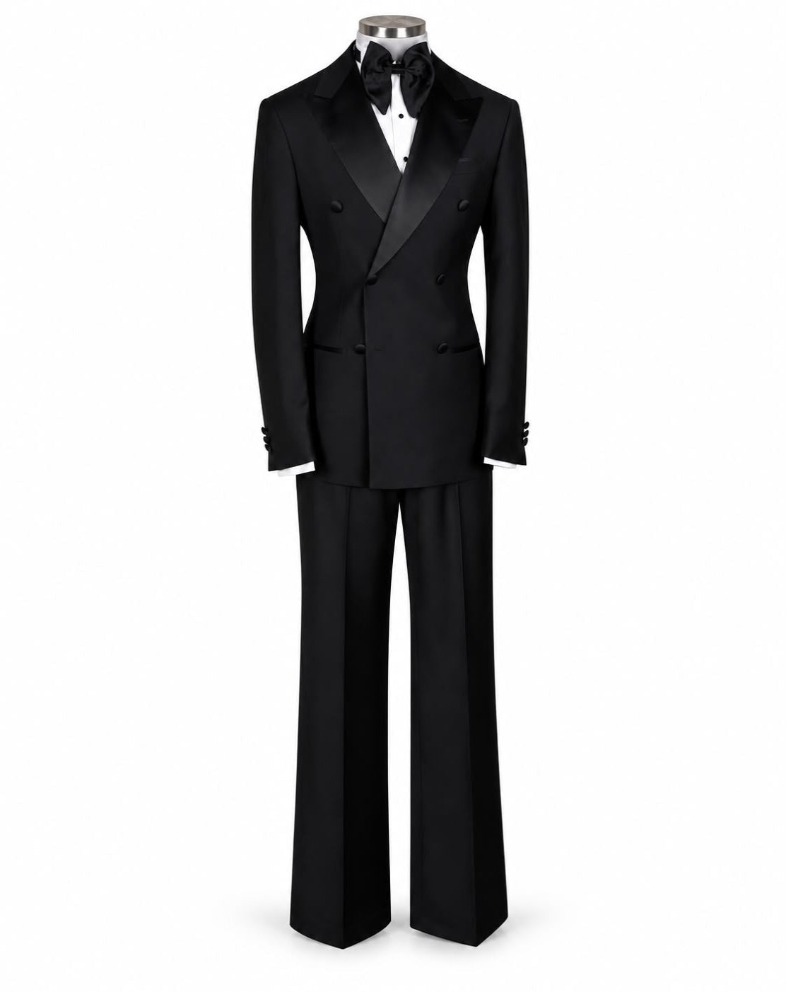 A black double-breasted tuxedo suit with satin lapels, shown on a mannequin torso with a black bow tie and white dress shirt against a plain white background.