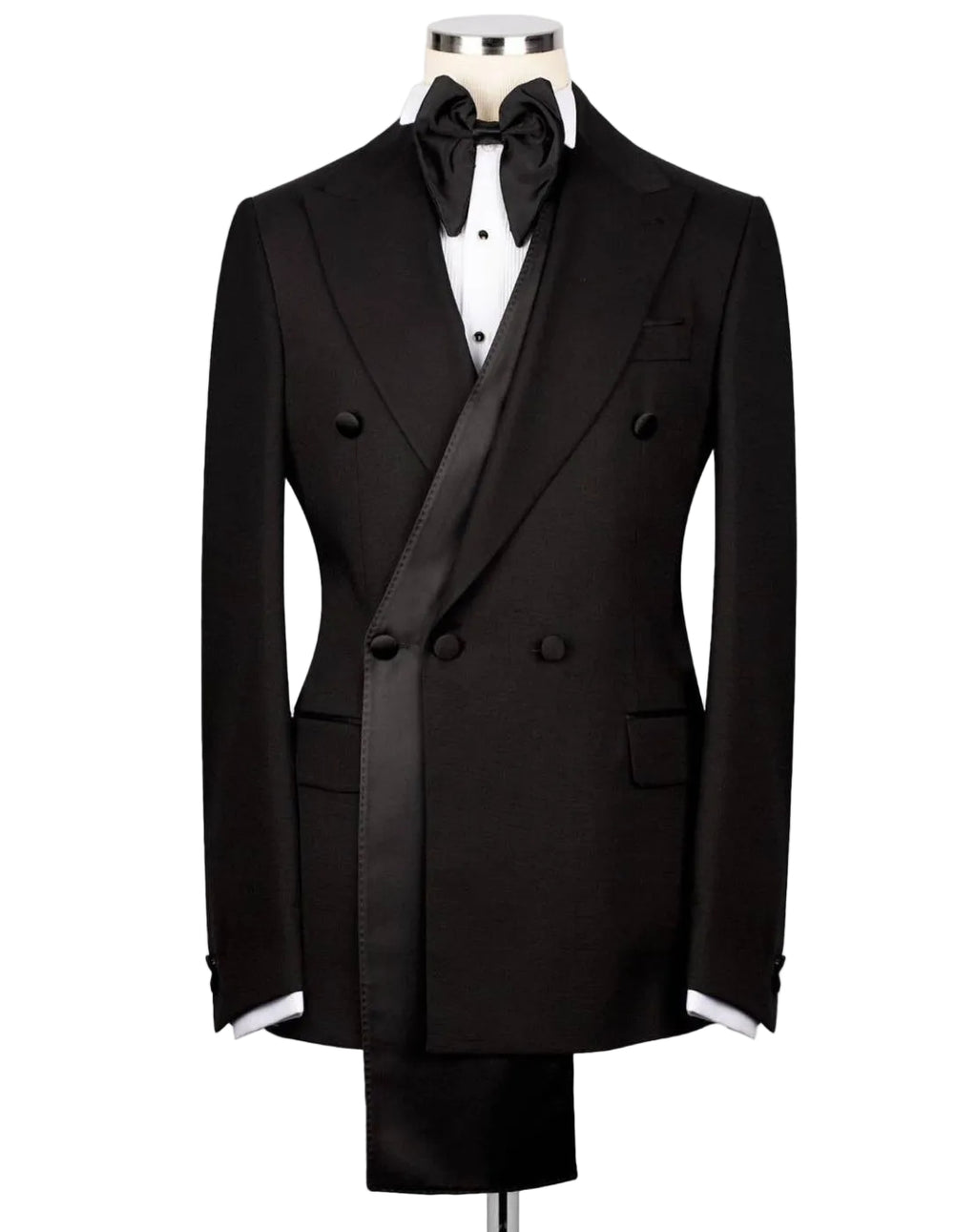 A black double-breasted tuxedo jacket displayed on a mannequin torso, styled with a black bow tie, white dress shirt, and matching black trousers