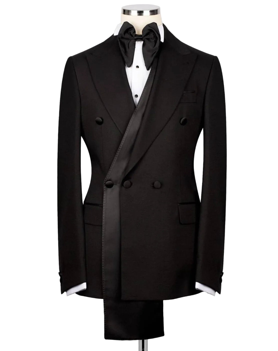 A black double-breasted tuxedo jacket displayed on a mannequin torso, styled with a black bow tie, white dress shirt, and matching black trousers