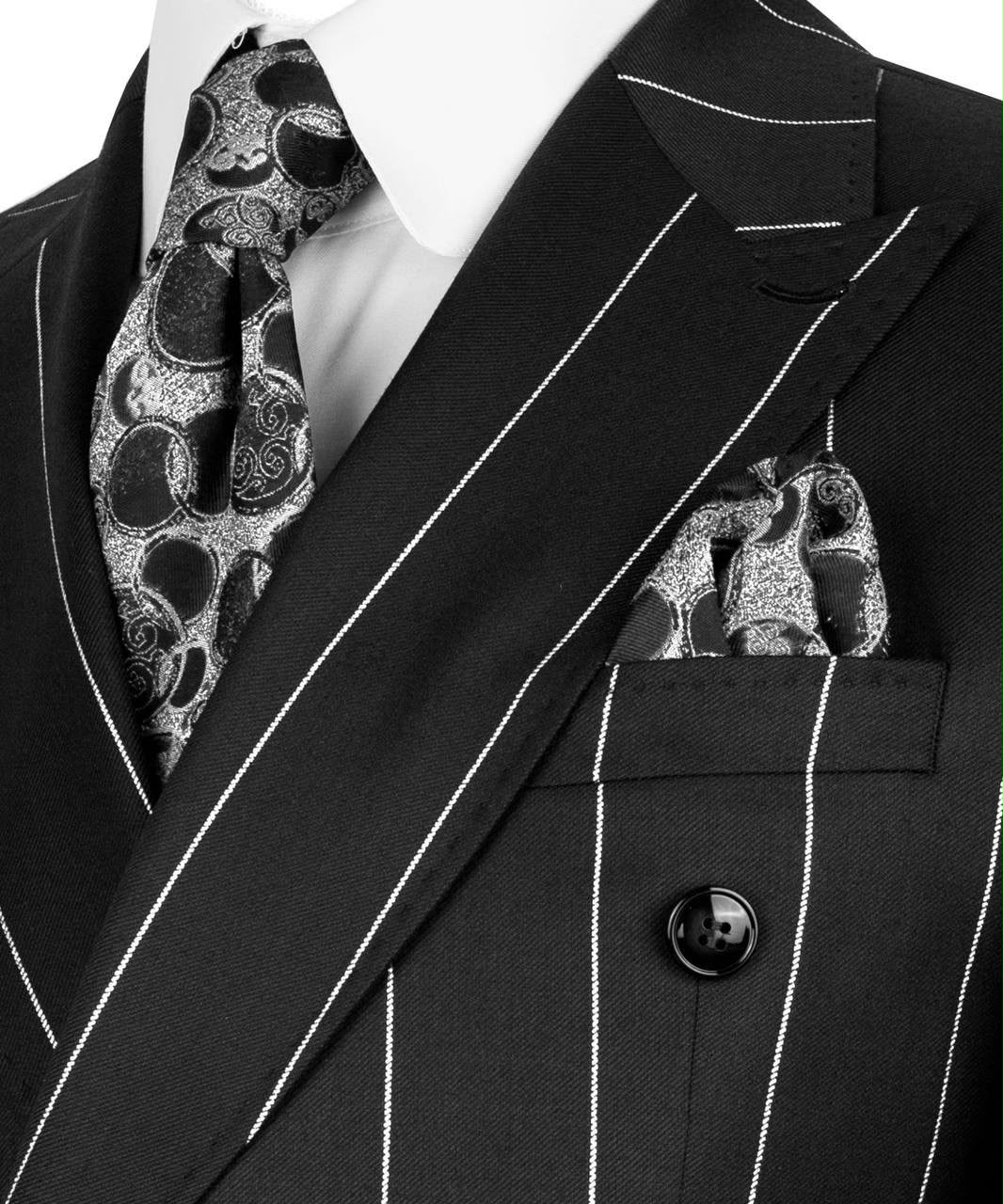 Black pinstripe suit with patterned tie and pocket square on a white background