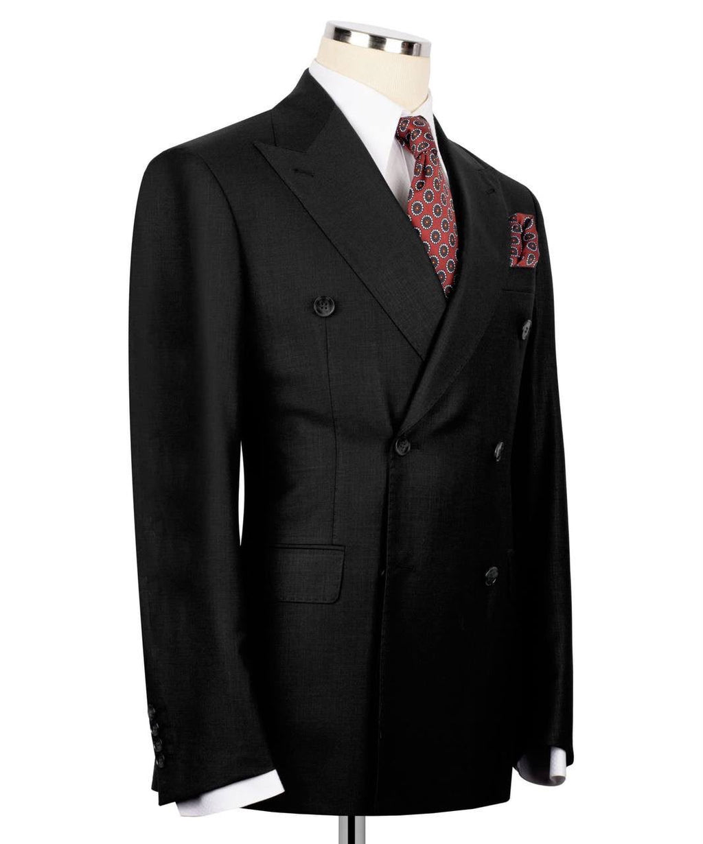 A black double-breasted suit jacket displayed on a mannequin torso, styled with a white dress shirt, a red and blue patterned tie, and a matching pocket square against a plain white background.