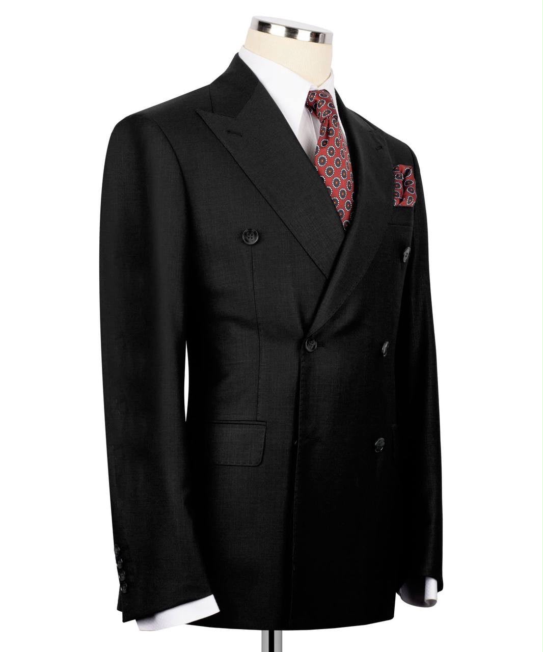 A black double-breasted suit jacket displayed on a mannequin torso, styled with a white dress shirt, a red and blue patterned tie, and a matching pocket square against a plain white background.