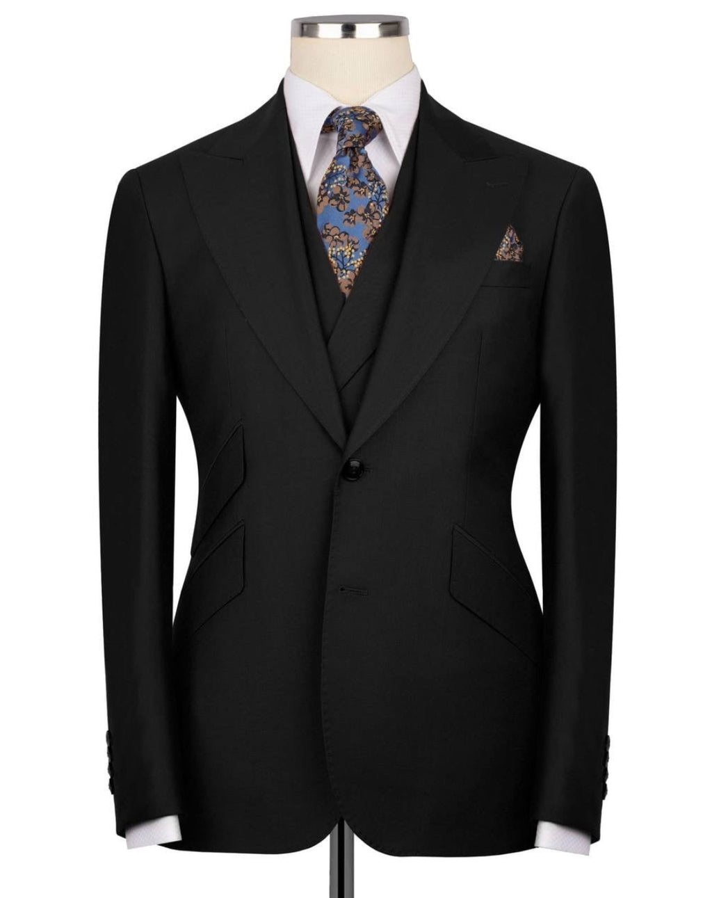 Black suit jacket on a mannequin with a patterned tie and pocket square 