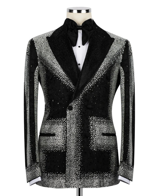 Black tuxedo jacket with silver sequin details on a mannequin against a white background