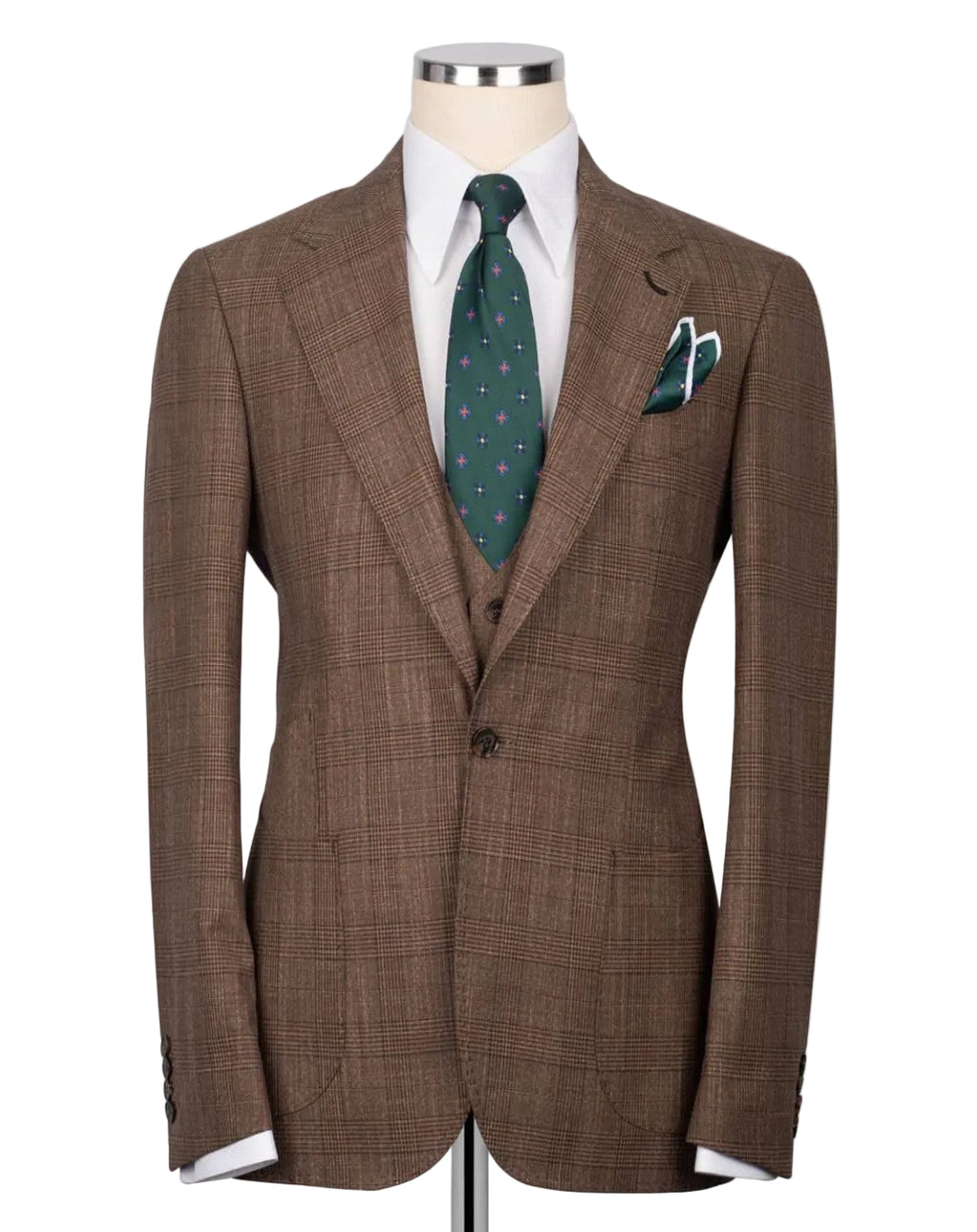 A brown plaid suit jacket displayed on a mannequin torso, styled with a white dress shirt, a green patterned tie, and a matching pocket square