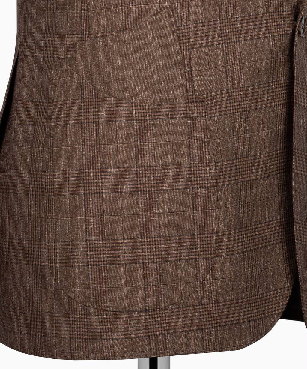Close-up of a brown plaid wool blazer jacket with a single front patch pocket, displayed on a mannequin torso.