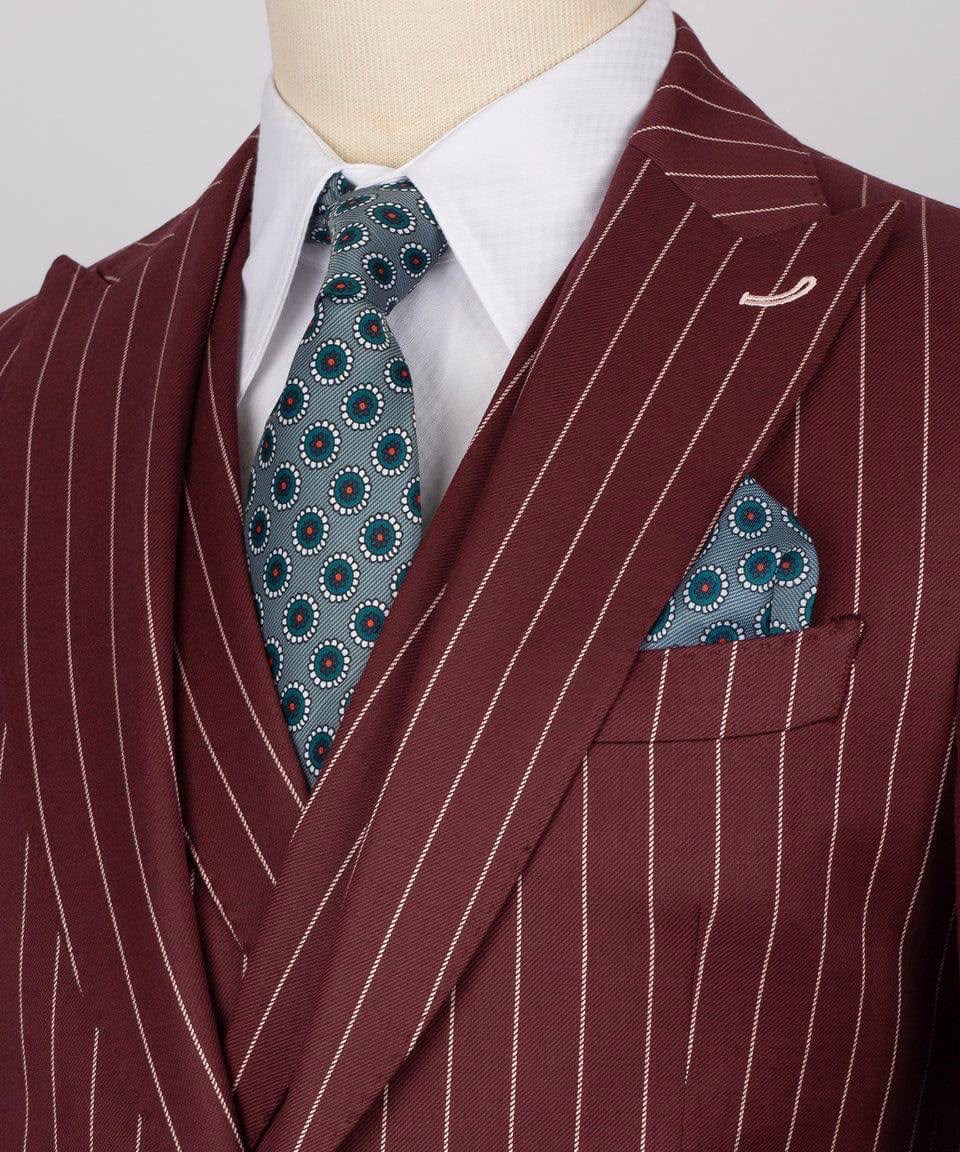 Maroon pinstripe suit with a patterned tie and pocket square on a mannequin.