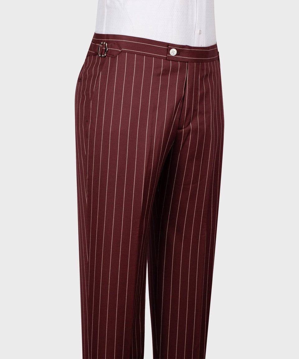 Maroon pinstripe pants with a white shirt on a light gray background