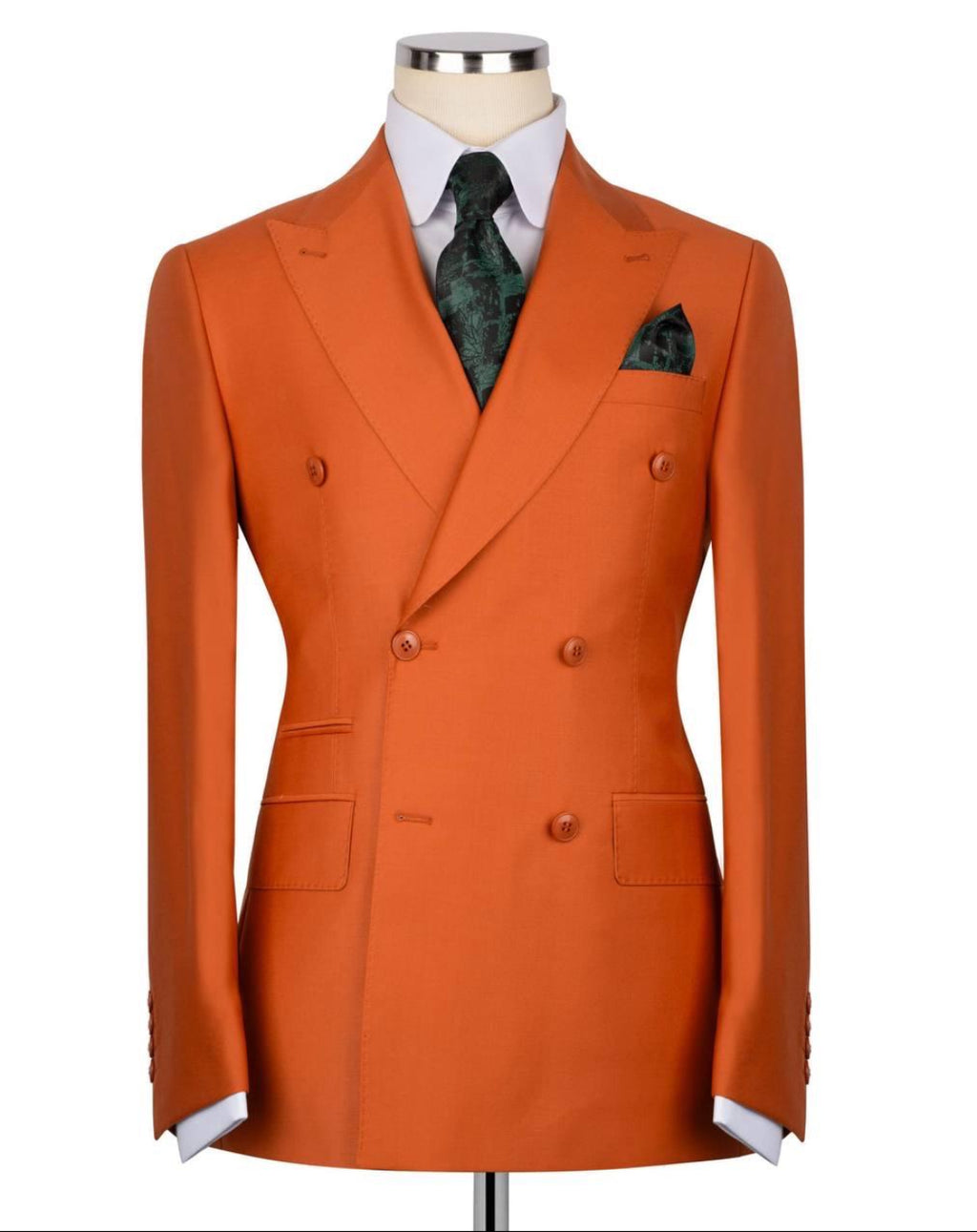 Orange double-breasted suit jacket on a mannequin with a white shirt and patterned tie.