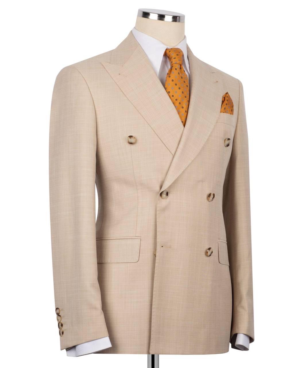 Beige double-breasted suit jacket on a mannequin with a white shirt and orange tie and pocket square.