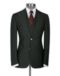 A dark forest green two-piece suit jacket and matching vest displayed on a mannequin, styled with a white dress shirt, a red patterned tie, and a matching pocket square