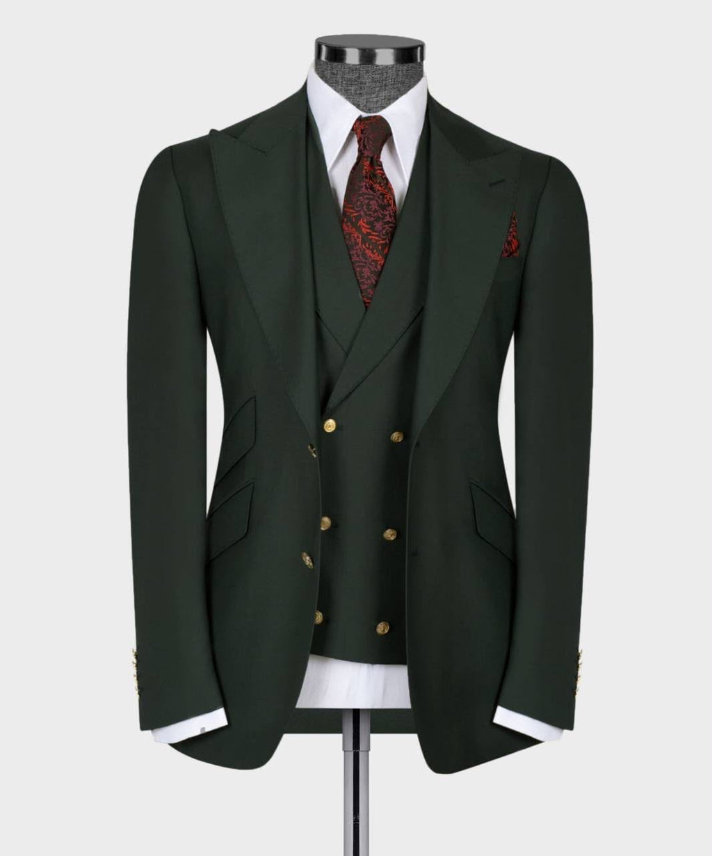 Dark green suit with a red patterned tie on a mannequin 