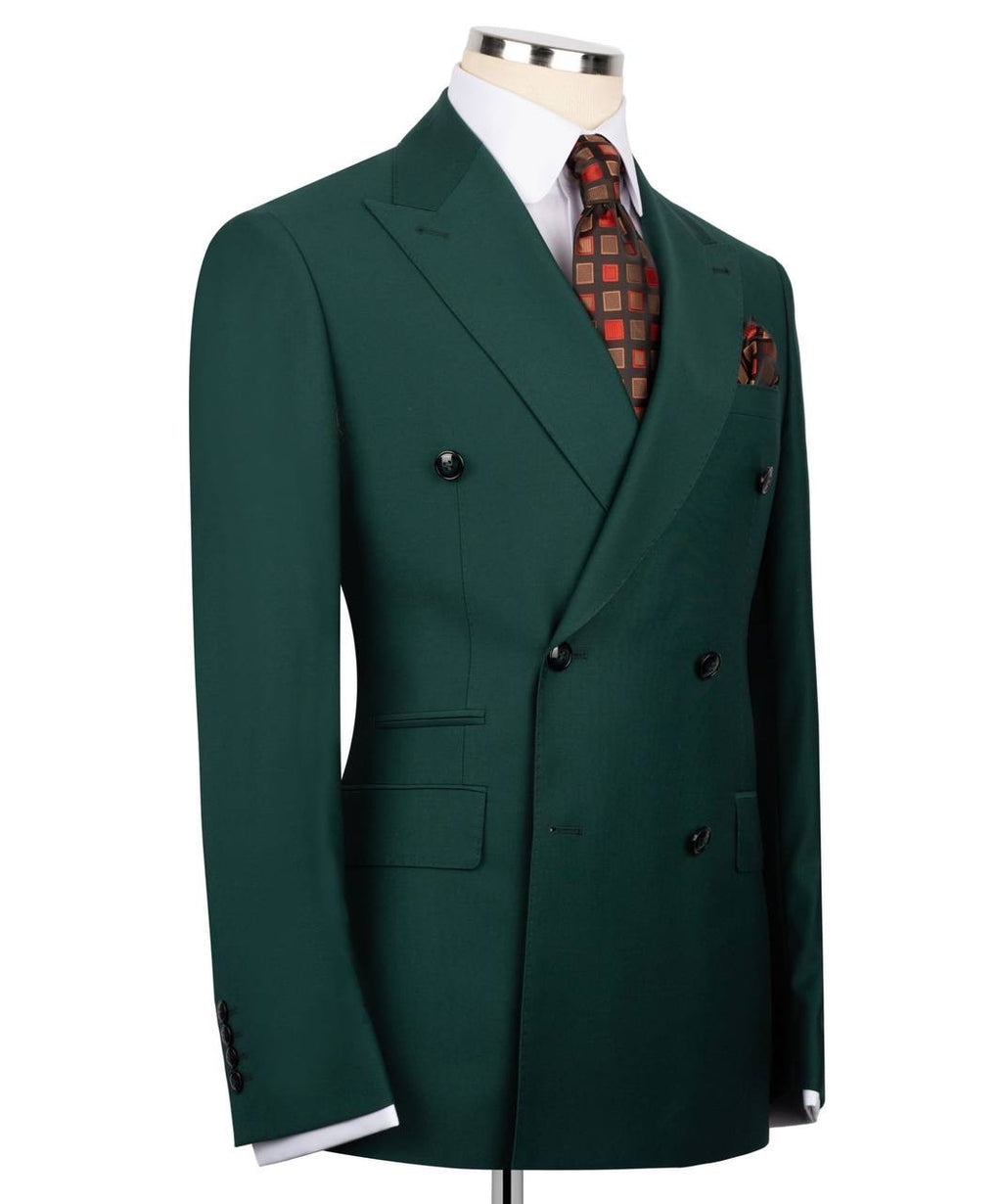 Green double-breasted suit jacket on a mannequin with a plaid tie and pocket square.