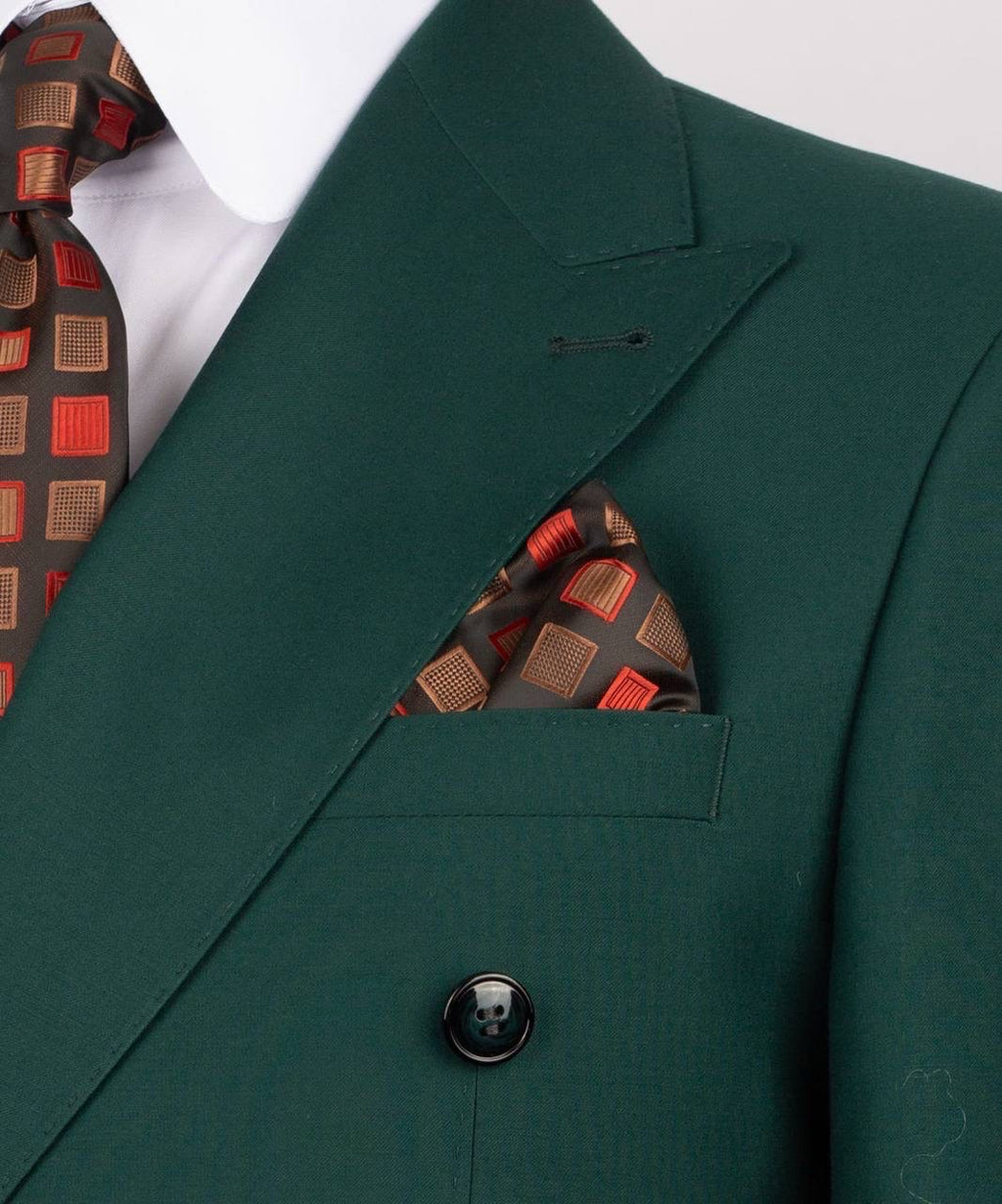 Green suit jacket with a patterned tie and pocket square 
