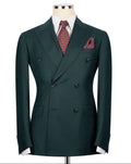 Green double-breasted suit jacket with a patterned tie and pocket square on a mannequin against a white background.